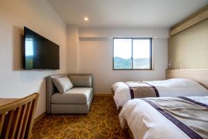 Кровать или кровати в номере Lectore Atami Koarashi - TKP Hotels & Resorts