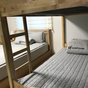 Postel nebo postele na pokoji v ubytování 24 Guesthouse Suncheon