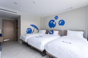 Postel nebo postele na pokoji v ubytování Kokotel Krabi Oasis + 18 fotografií