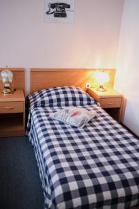 Postel nebo postele na pokoji v ubytování Hotel Veli Jože