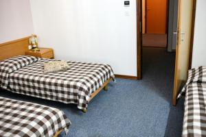 Postel nebo postele na pokoji v ubytování Hotel Veli Jože