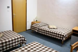 Postel nebo postele na pokoji v ubytování Hotel Veli Jože