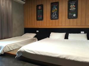 Katil atau katil-katil dalam bilik di 羅東夜市 工業Loft旅宿