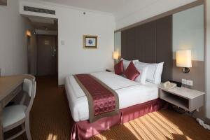 Ένα ή περισσότερα κρεβάτια σε δωμάτιο στο Sunway Hotel Hanoi