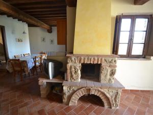 Posedenie v ubytovaní Apartment in Asciano with Panoramic Views
