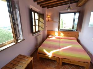 Posteľ alebo postele v izbe v ubytovaní Apartment in Asciano with Panoramic Views