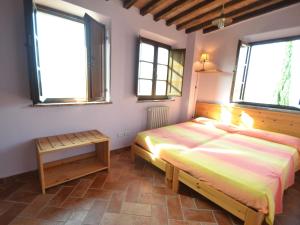 Posteľ alebo postele v izbe v ubytovaní Apartment in Asciano with Panoramic Views