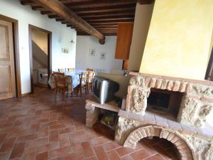 Posedenie v ubytovaní Apartment in Asciano with Panoramic Views