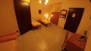 a view of a living room with a couch and chairs at Villa Jolanda & Carmelo in Villaggio Mosè