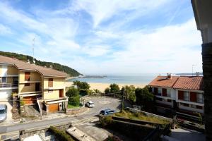 a view of the ocean from a building at Higer Bidea 1 - Basquenjoy in Hondarribia