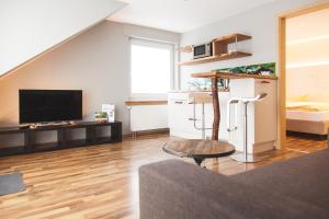 TV a/nebo společenská místnost v ubytování Flair Hotel Nieder