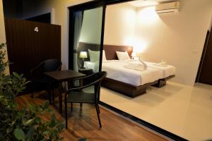 Postel nebo postele na pokoji v ubytování Aonang Glory Resort + 21 fotografií