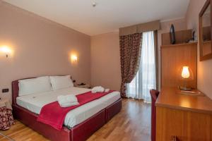 Postel nebo postele na pokoji v ubytování SIRIOHotel