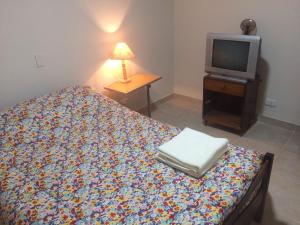 מיטה או מיטות בחדר ב-Departamentos Urquiza