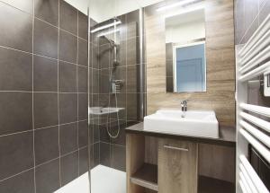 a bathroom with a sink and a shower at Résidence Odalys Domaine des Eucalyptus in Saint-Aygulf +49 photos