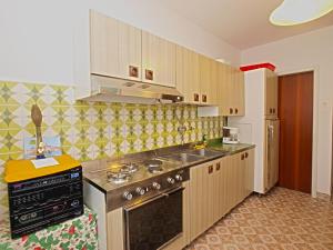 Kuchyň nebo kuchyňský kout v ubytování Rooms Milan 1370