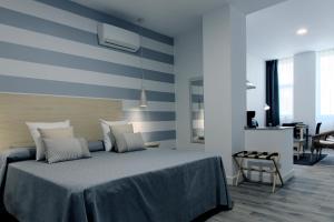 Posteľ alebo postele v izbe v ubytovaní Hotel Apartamentos MPD