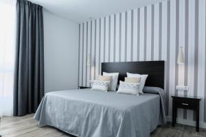 Posteľ alebo postele v izbe v ubytovaní Hotel Apartamentos MPD