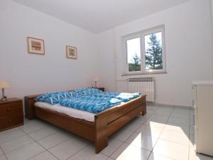 Postel nebo postele na pokoji v ubytování Apartments Zorka 1421