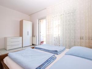 Postel nebo postele na pokoji v ubytování Apartments Zorka 1421