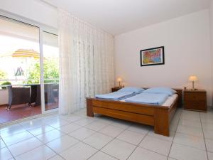 Postel nebo postele na pokoji v ubytování Apartments Zorka 1421