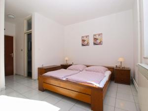 Postel nebo postele na pokoji v ubytování Apartments Zorka 1421