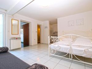 Postel nebo postele na pokoji v ubytování Apartments Zorka 1421