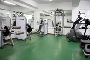 a gym with several treadmills and cardio machines at Makronisos Village in Ayia Napa