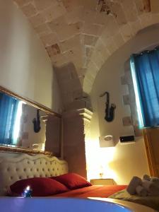 Postel nebo postele na pokoji v ubytování L'antico palazzo