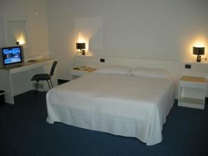 Postel nebo postele na pokoji v ubytování Hotel Giovanni