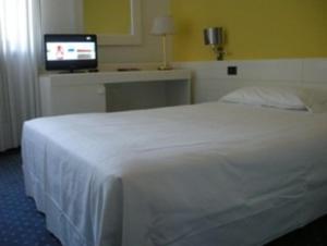 Postel nebo postele na pokoji v ubytování Hotel Giovanni