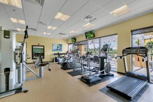 a gym with treadmills and cardio equipment in a building at Disney Themed Family Villa, Waterpark & Resort Amenities Included in Kissimmee