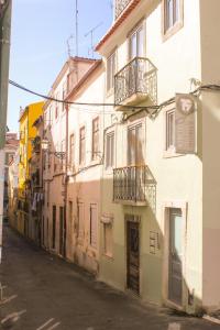 an alley with buildings on the side of a street at 19inLisbon at Intendente in Lisbon