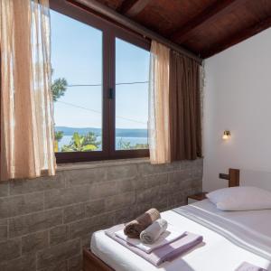 Posteľ alebo postele v izbe v ubytovaní Beach Time Villa