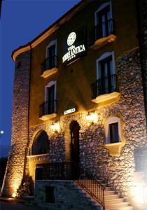 a building with a sign on the side of it at Hotel Villa Torre Antica in Atena Lucana