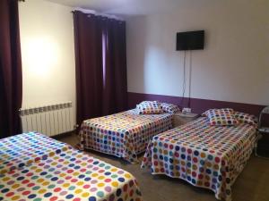 Postel nebo postele na pokoji v ubytování Hostal la Catedral
