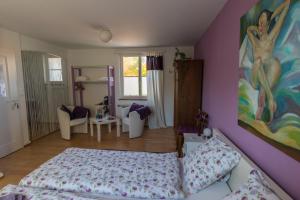 Letto o letti in una camera di B&B Kalimera Pratteln