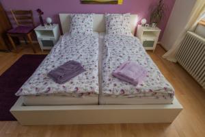 Letto o letti in una camera di B&B Kalimera Pratteln