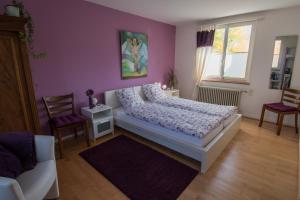 Letto o letti in una camera di B&B Kalimera Pratteln