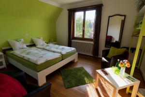 Letto o letti in una camera di B&B Kalimera Pratteln