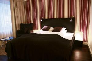 Letto o letti in una camera di First Hotel Witt