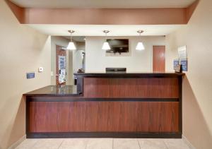 a lobby with a reception desk in a hospital at Cobblestone Inn & Suites - Big Lake in Big Lake