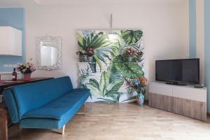 Televízia a/alebo spoločenská miestnosť v ubytovaní Saragozza Apartments