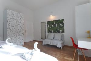 Posteľ alebo postele v izbe v ubytovaní Saragozza Apartments