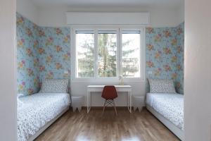 Posteľ alebo postele v izbe v ubytovaní Saragozza Apartments