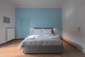 Posteľ alebo postele v izbe v ubytovaní Saragozza Apartments