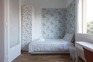 Posteľ alebo postele v izbe v ubytovaní Saragozza Apartments