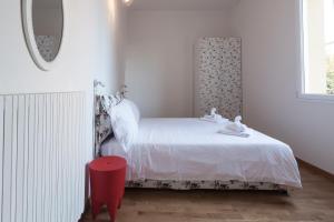 Posteľ alebo postele v izbe v ubytovaní Saragozza Apartments