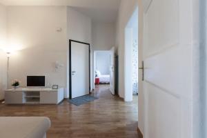 Televízia a/alebo spoločenská miestnosť v ubytovaní Saragozza Apartments