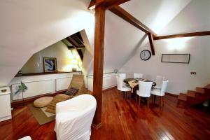 a living room with a table and chairs at Residence Salvator - by Prague City Apartments in Prague